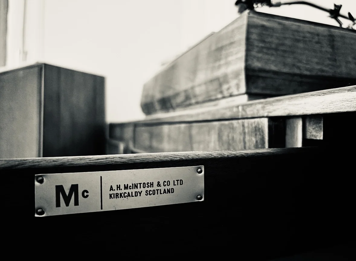 Turntable on a mid-century sideboard, analogue setup, warm light