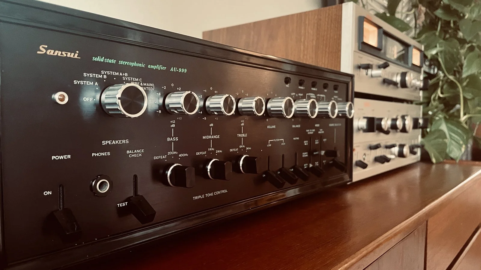 A Sansui amplifier, solid-state stereophonic, the dials and switches in close detail