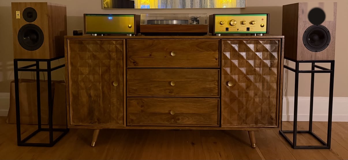 The system, on the sideboard, flanked by both pairs of speakers