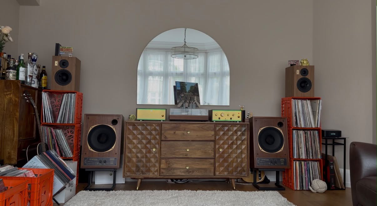 The full room, records in crates on either side, shag pile in the foreground